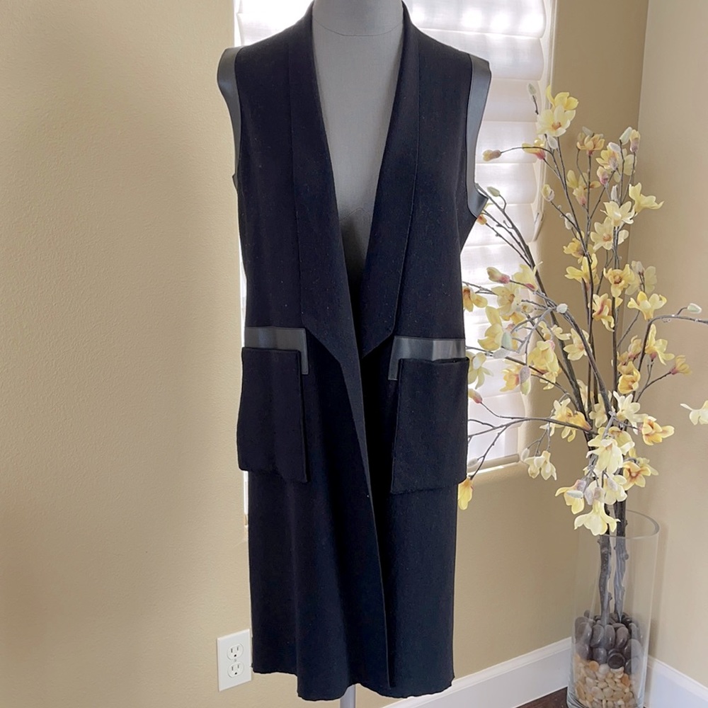Beautiful Moschino wool and leather black long vest. Eye-catching back design